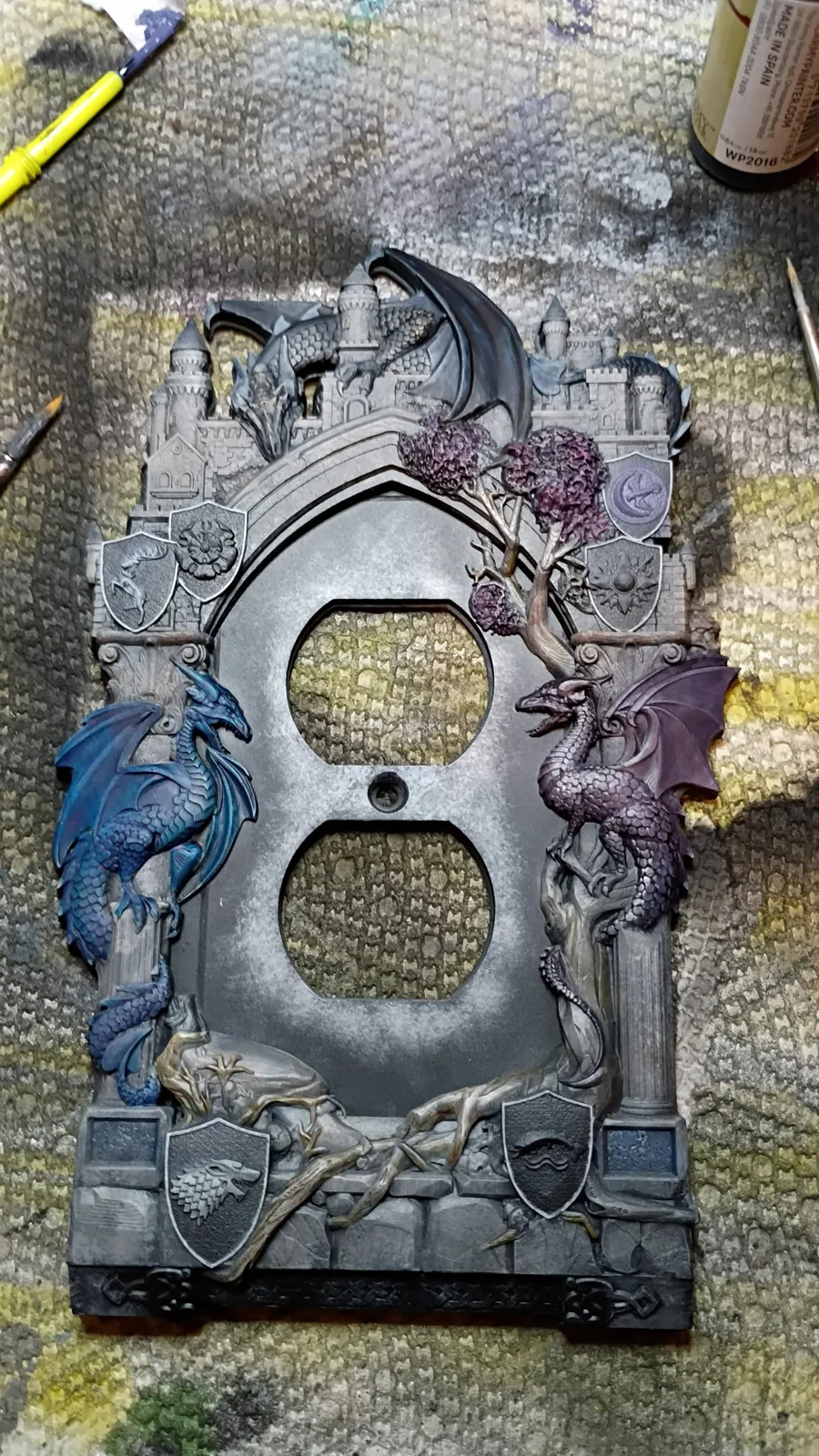 A painted stone doorway terrain piece with colored details
